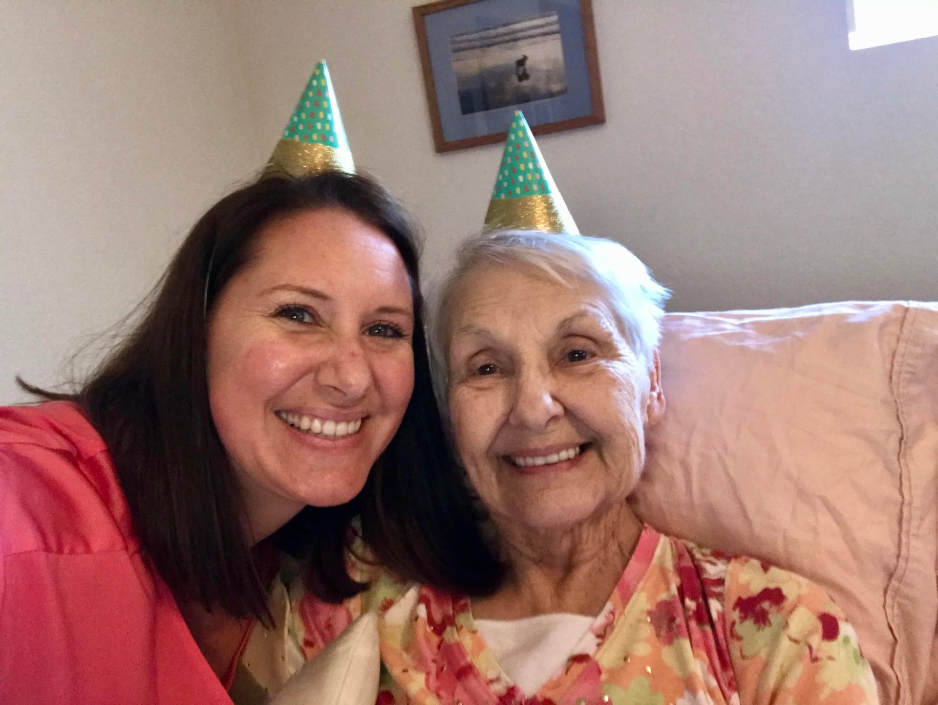 Satin and her mom Mary Louise wearing matching llama party hats on Mom's last birthday